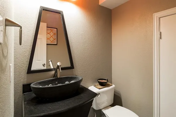 a bathroom with a toilet and a sink