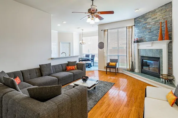 a living room with furniture and a fireplace