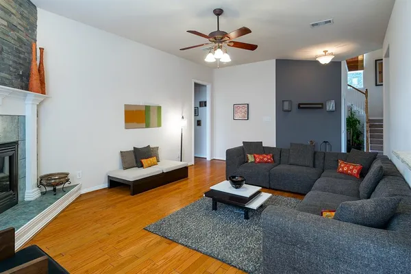 a living room with furniture and a rug
