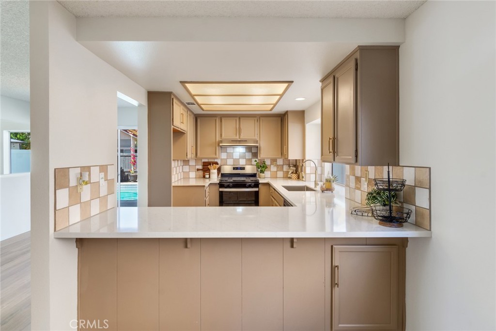 3682 North Pole Lane Riverside, CA 92503 - Photo 12 of 30 a kitchen with counter top space and cabinets