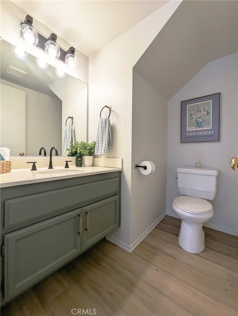 3682 North Pole Lane Riverside, CA 92503 - Photo 17 of 30 a bathroom with a toilet sink and mirror