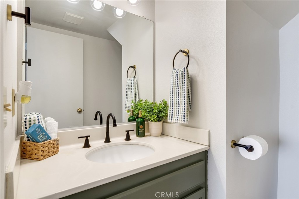 3682 North Pole Lane Riverside, CA 92503 - Photo 18 of 30 a bathroom with a sink and mirror