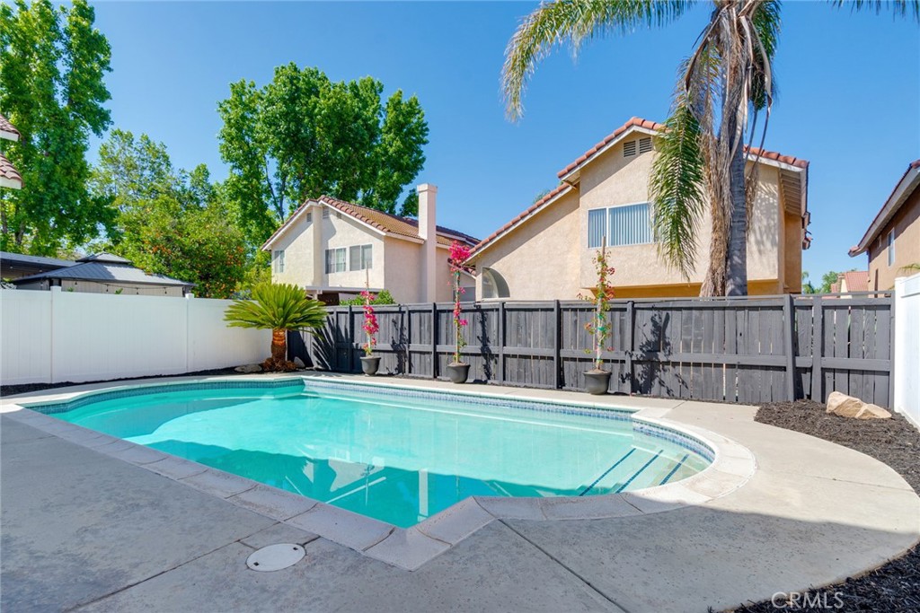 3682 North Pole Lane Riverside, CA 92503 - Photo 2 of 30 a view of a house with pool and chairs