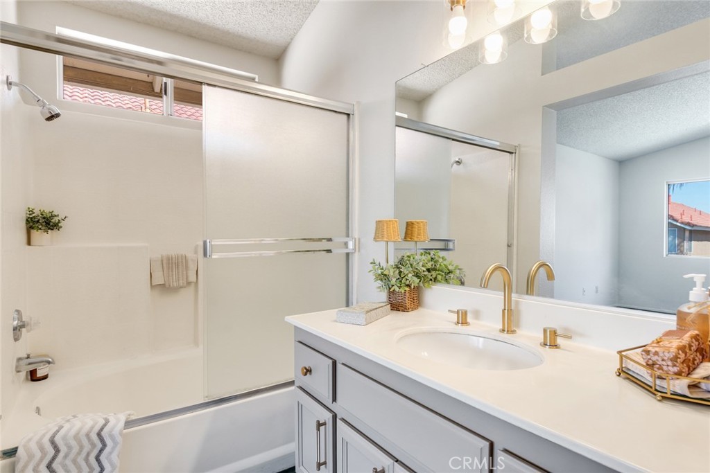 3682 North Pole Lane Riverside, CA 92503 - Photo 22 of 30 a bathroom with a sink and a mirror