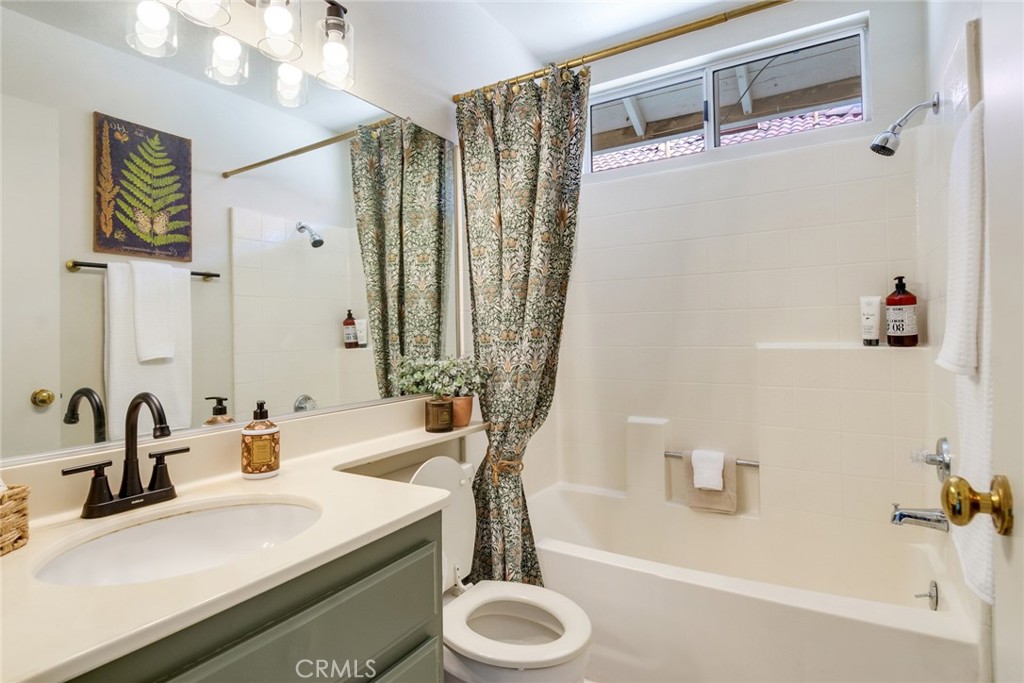 3682 North Pole Lane Riverside, CA 92503 - Photo 24 of 30 a bathroom with a sink a toilet and shower