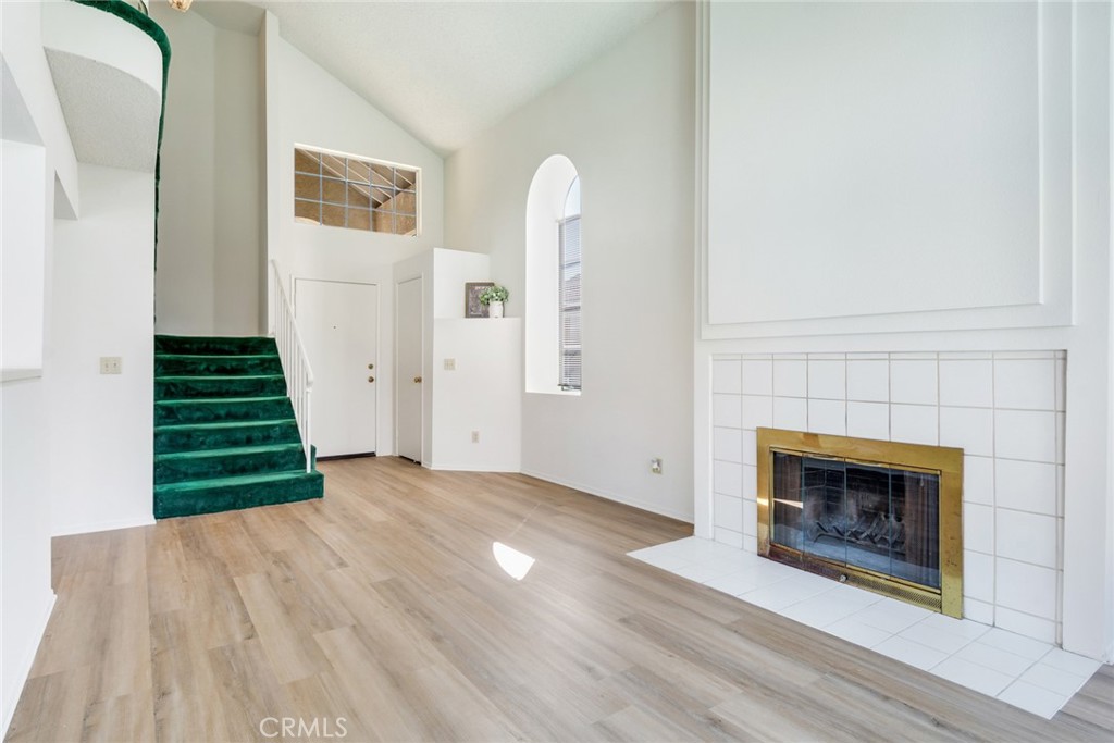 3682 North Pole Lane Riverside, CA 92503 - Photo 6 of 30 an empty room with windows and a fireplace