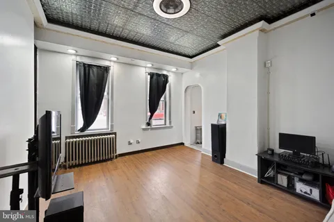 a view of an entryway with wooden floor