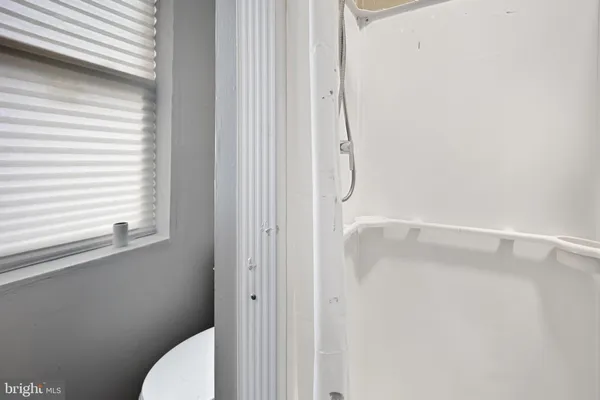 a bathroom with a shower curtain