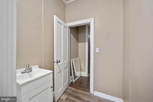 a bathroom with a sink and mirror
