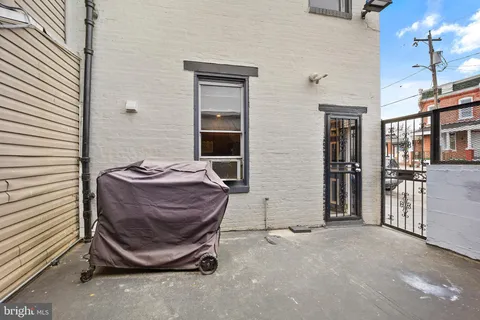 a view of a livingroom with furniture and front door