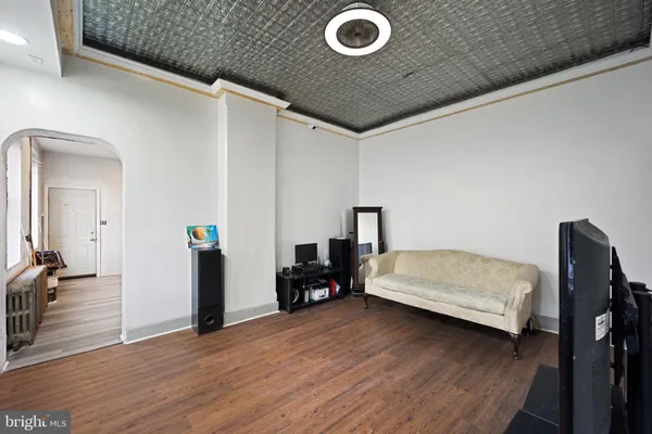 a bedroom with a bed and a chair