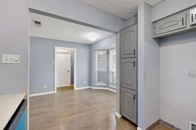 a view of entryway with wooden floor