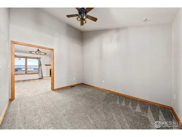 a large kitchen with stainless steel appliances granite countertop a stove a sink dishwasher a microwave oven with cabinets and wooden floor