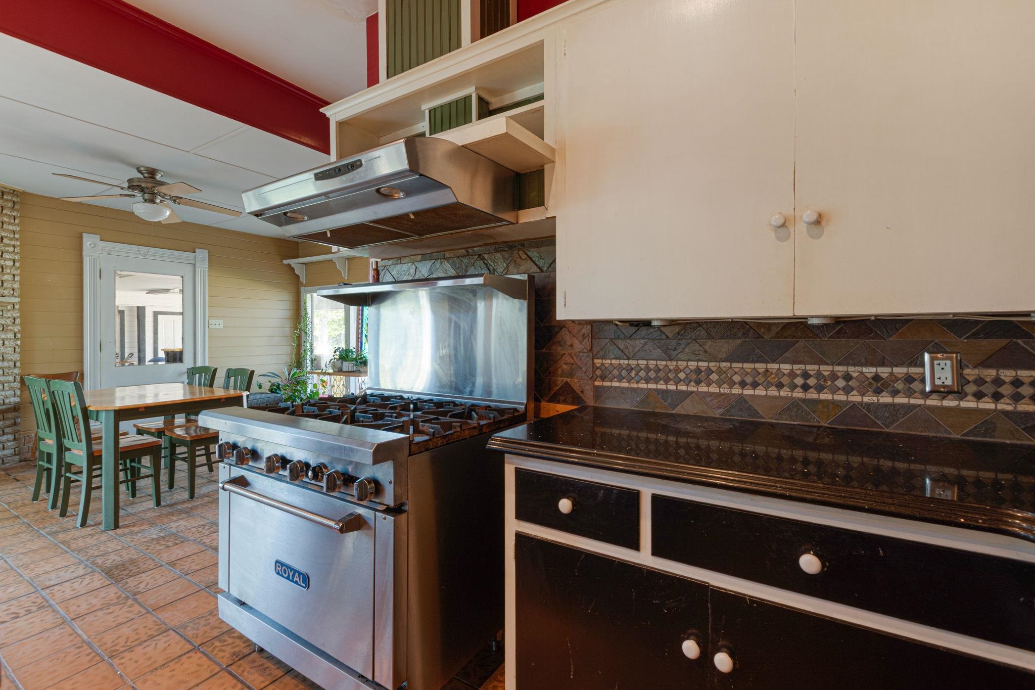106 South Howe Street Lampasas, TX 76550 - Photo 15 of 29 a stove top oven sitting inside of a kitchen