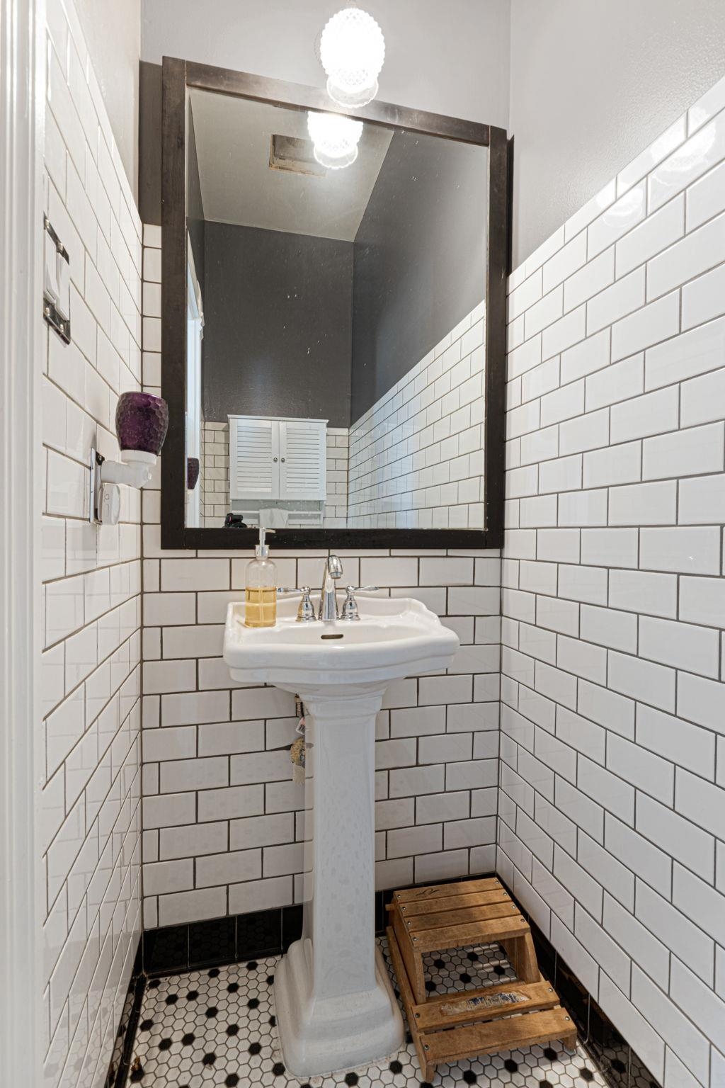 106 South Howe Street Lampasas, TX 76550 - Photo 21 of 29 a bathroom with a sink and a mirror