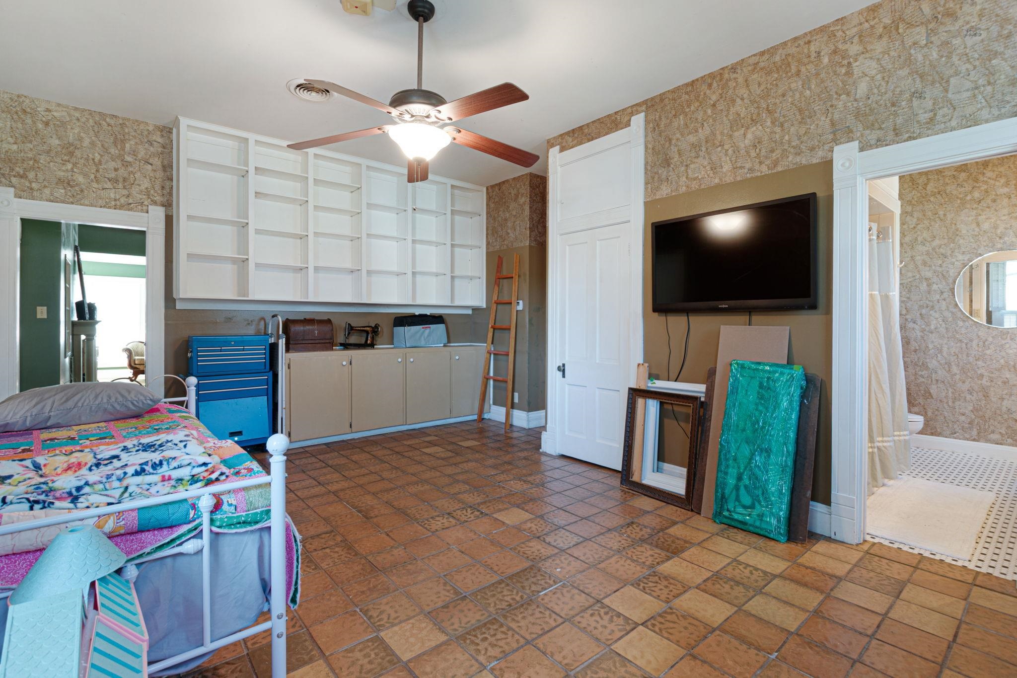 106 South Howe Street Lampasas, TX 76550 - Photo 22 of 29 a view of a livingroom with furniture and a flat screen tv