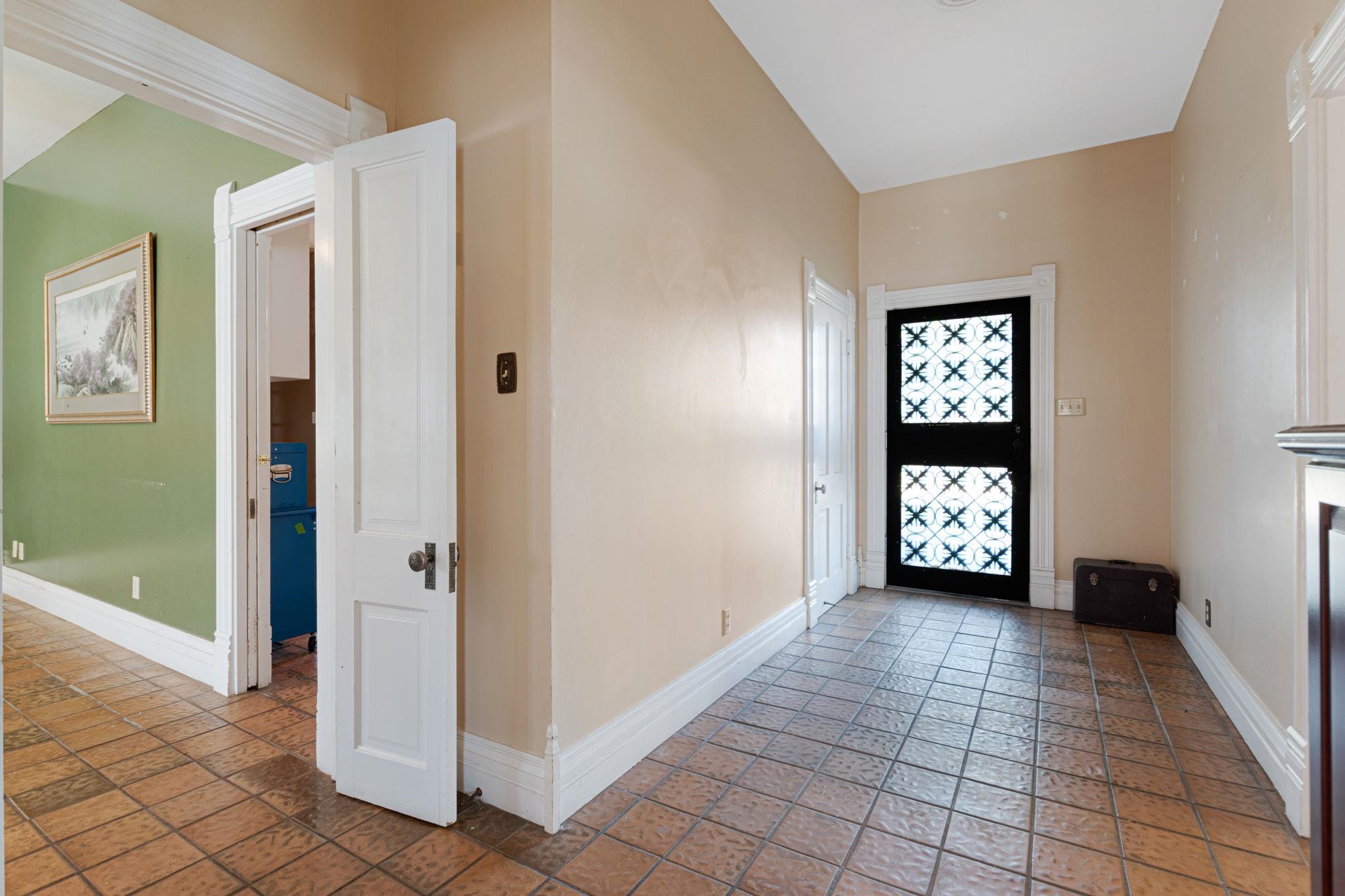 106 South Howe Street Lampasas, TX 76550 - Photo 4 of 29 a view of an entryway and a room with windows