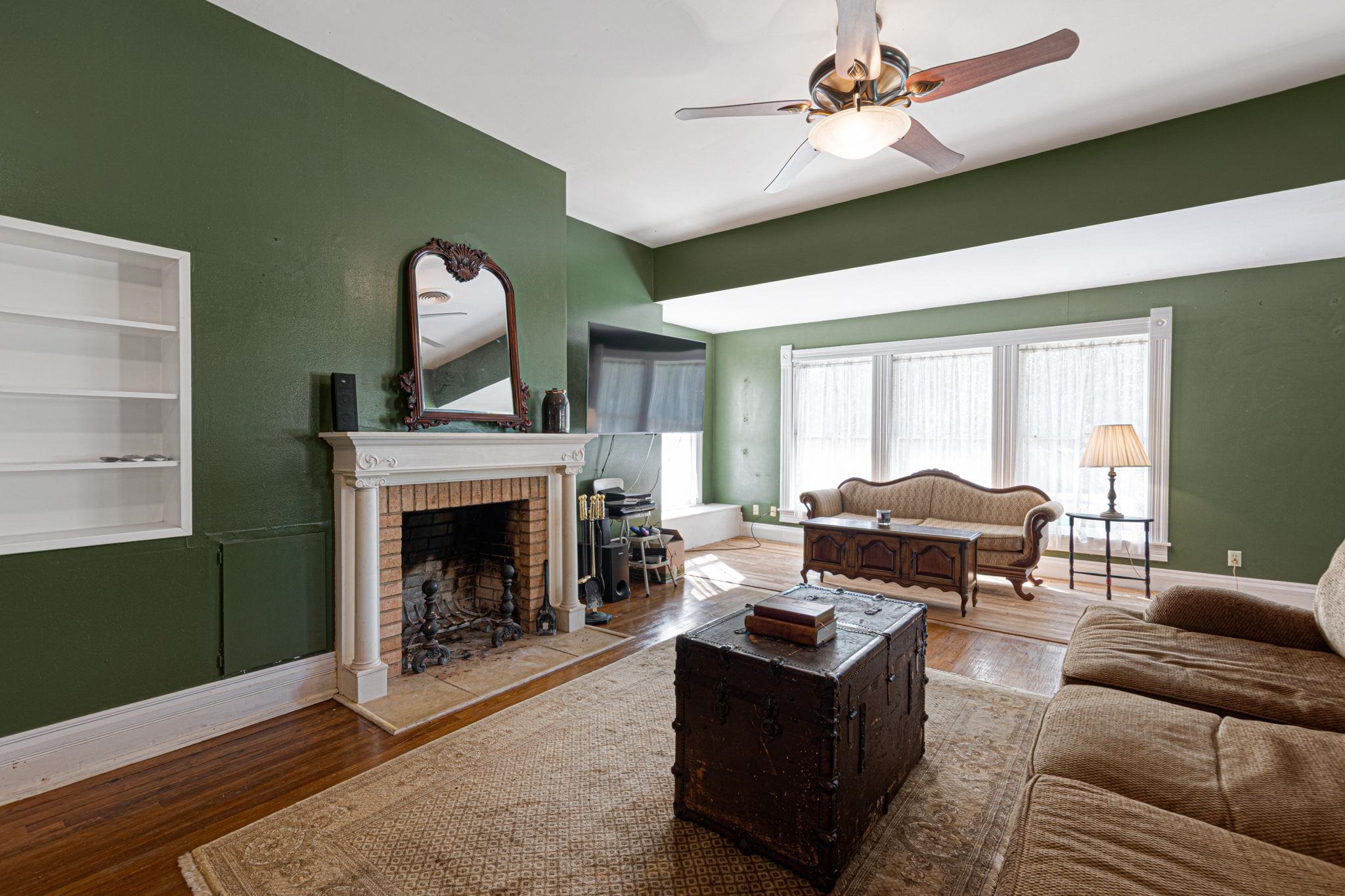 106 South Howe Street Lampasas, TX 76550 - Photo 7 of 29 a living room with furniture and a fireplace