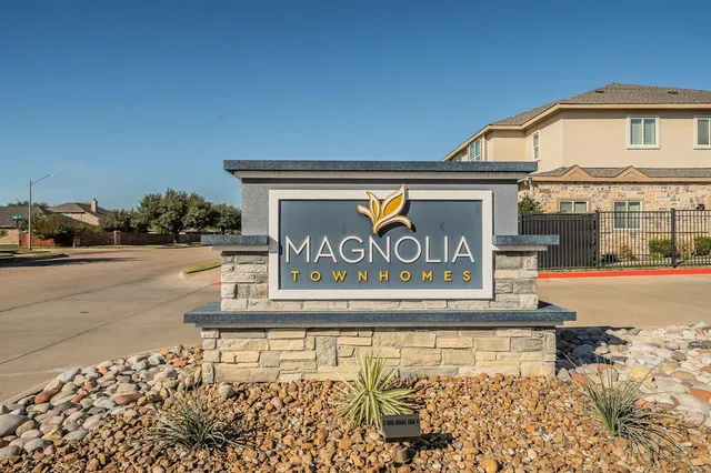 a view of building with sign broad