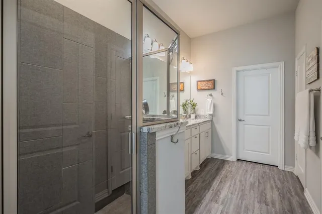 a bathroom with a sink and mirror