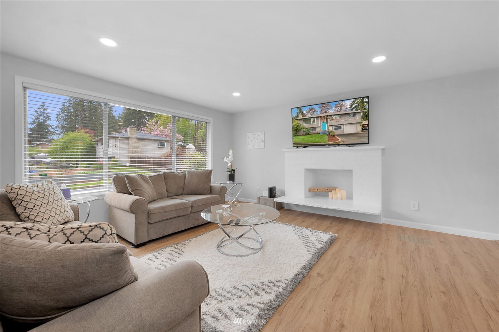21823 2nd Avenue West Bothell, WA 98021 - Photo 7 of 30 a living room with furniture and a floor to ceiling window