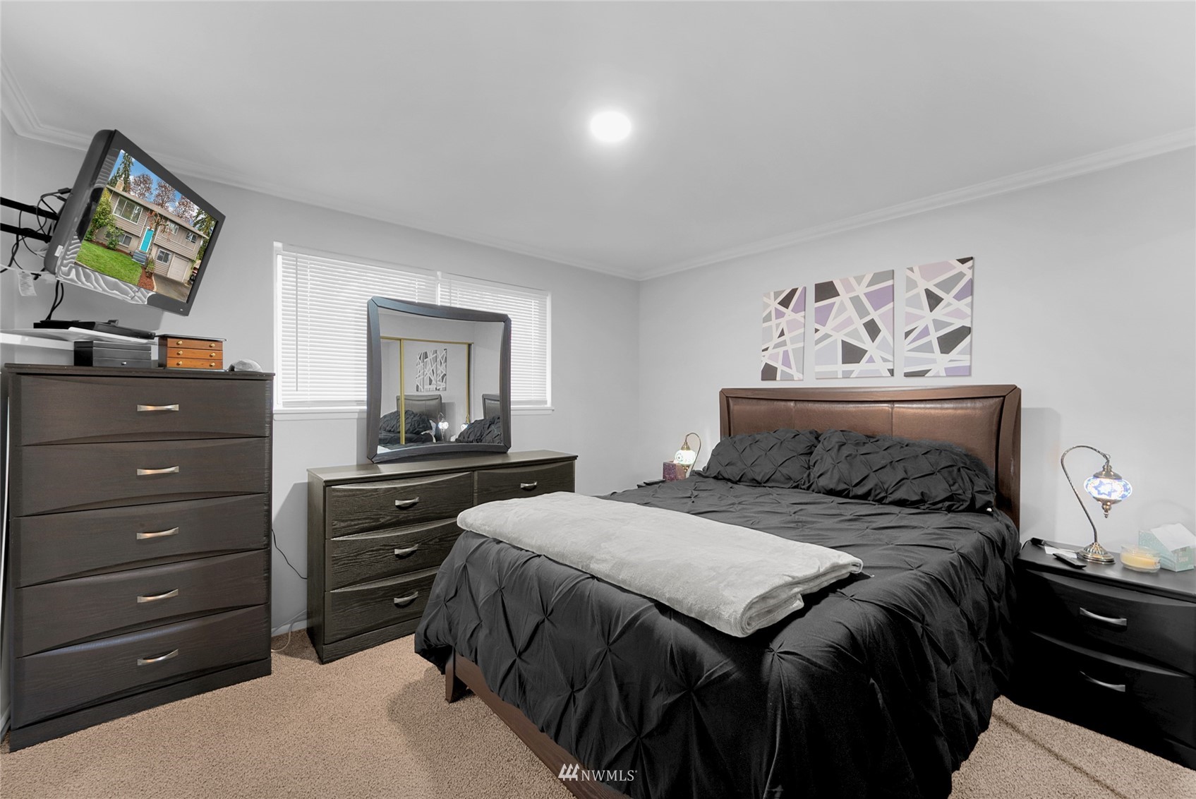 21823 2nd Avenue West Bothell, WA 98021 - Photo 9 of 30 a bedroom with a bed and a painting on the wall