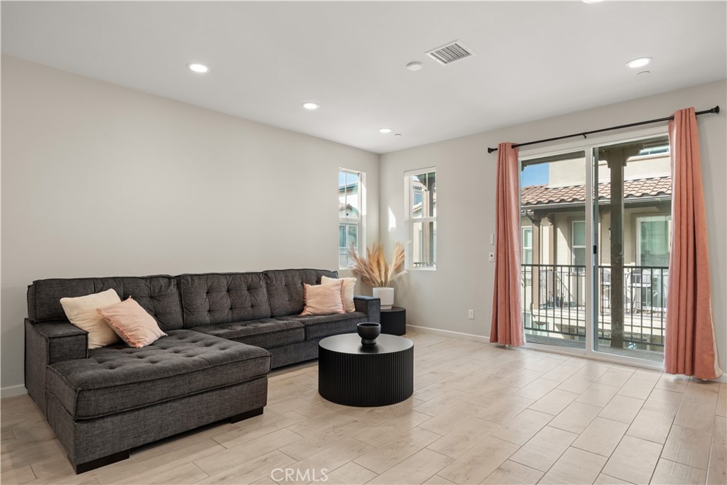 31305 Via Nubes Temecula, CA 92592 - Photo 12 of 27 a living room with furniture and floor to ceiling window