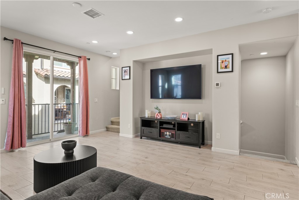 31305 Via Nubes Temecula, CA 92592 - Photo 13 of 27 a living room with furniture and a flat screen tv