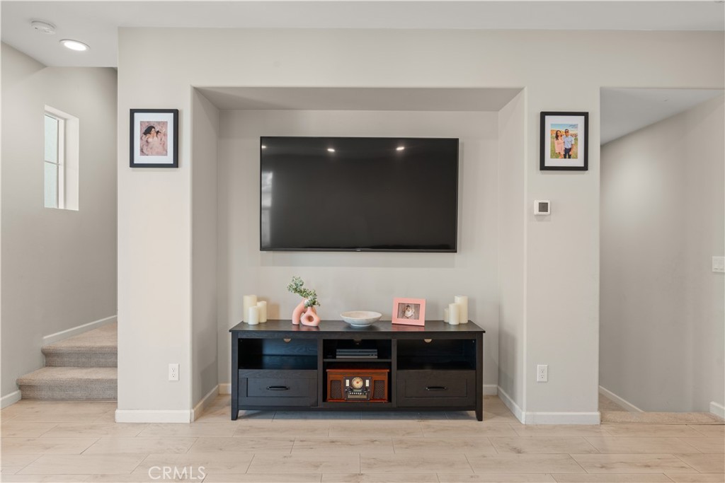 31305 Via Nubes Temecula, CA 92592 - Photo 16 of 27 a living room with furniture and a flat screen tv