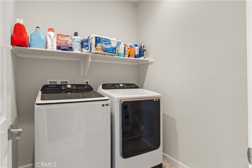 31305 Via Nubes Temecula, CA 92592 - Photo 18 of 27 a utility room with dryer and washer