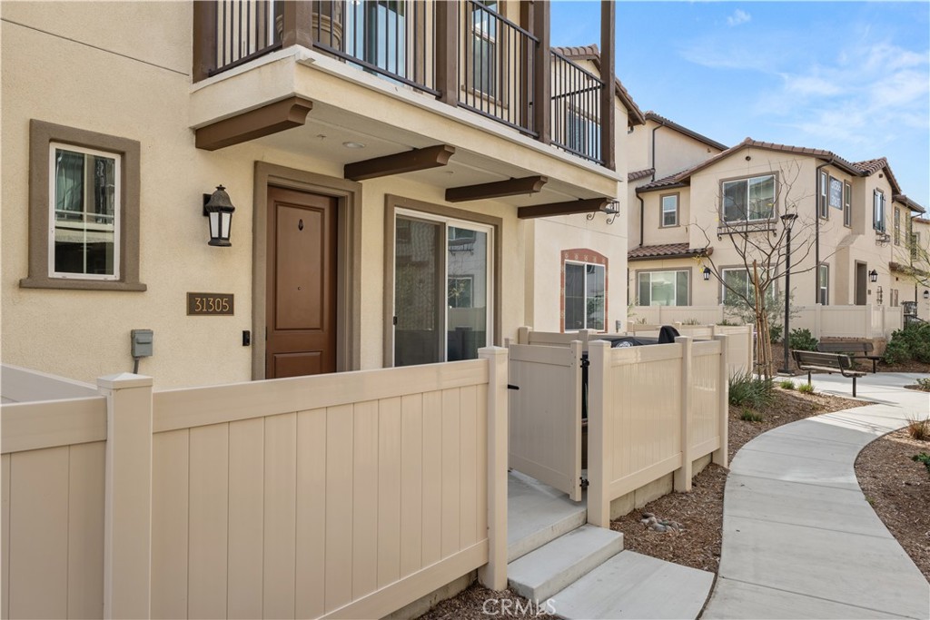 31305 Via Nubes Temecula, CA 92592 - Photo 22 of 27 front view of a house with a street