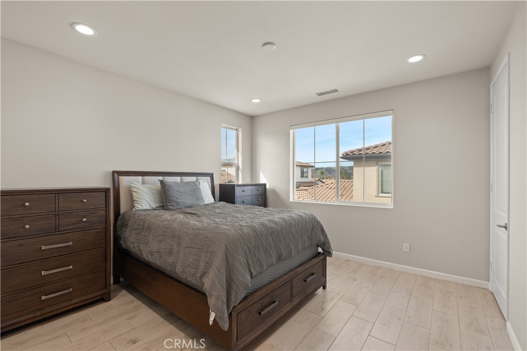 31305 Via Nubes Temecula, CA 92592 - Photo 24 of 27 a bedroom with a bed and window