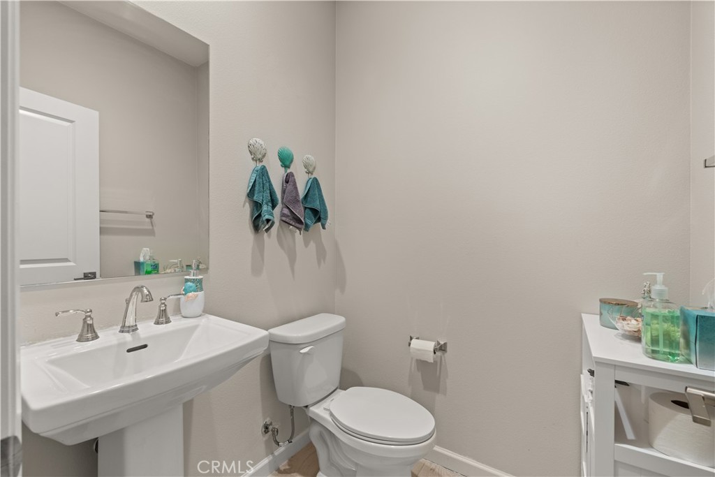 31305 Via Nubes Temecula, CA 92592 - Photo 5 of 27 a bathroom with a sink toilet and a mirror