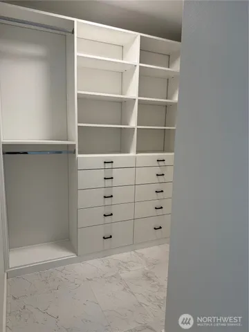 a view of an empty walk in closet