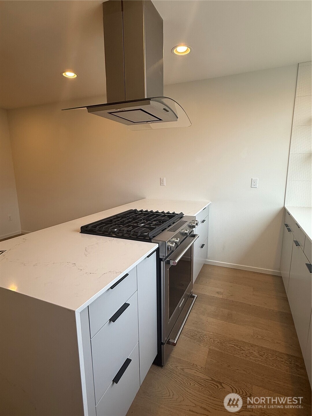 817 24th Avenue South, Unit B Seattle, WA 98144 - Photo 4 of 33 a kitchen that has a sink and a stove