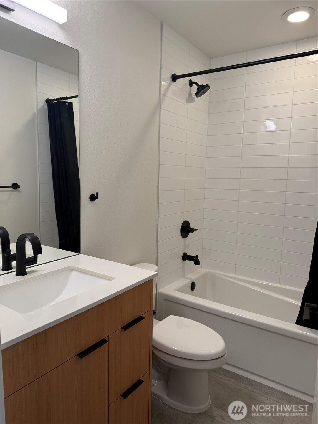 817 24th Avenue South, Unit B Seattle, WA 98144 - Photo 7 of 33 a bathroom with a sink a toilet and shower