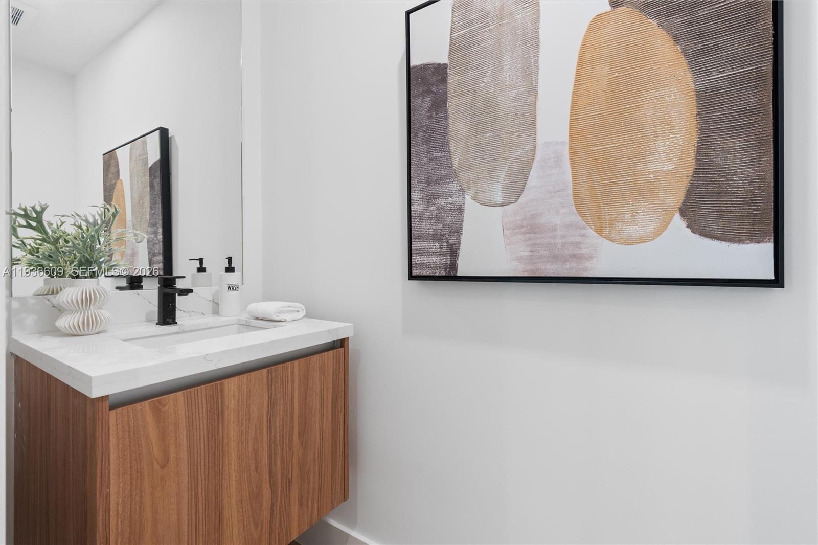 1247 Southwest 13th Avenue Miami, FL 33135 - Photo 12 of 22 a bathroom with a sink and a mirror