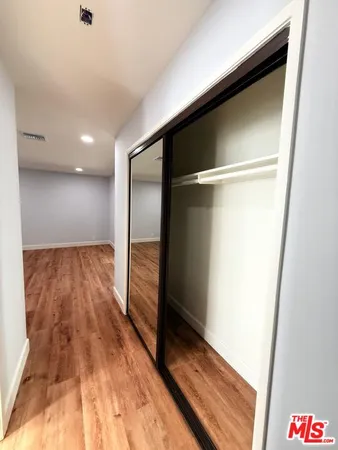 a bathroom with a sink vanity granite and a mirror