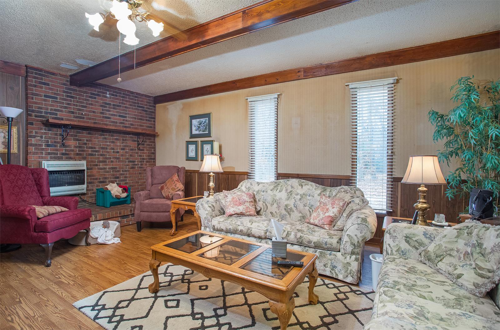 1803 Friendship Road Cross Plains, TN 37049 - Photo 11 of 20 a living room with furniture a fireplace and a flat screen tv