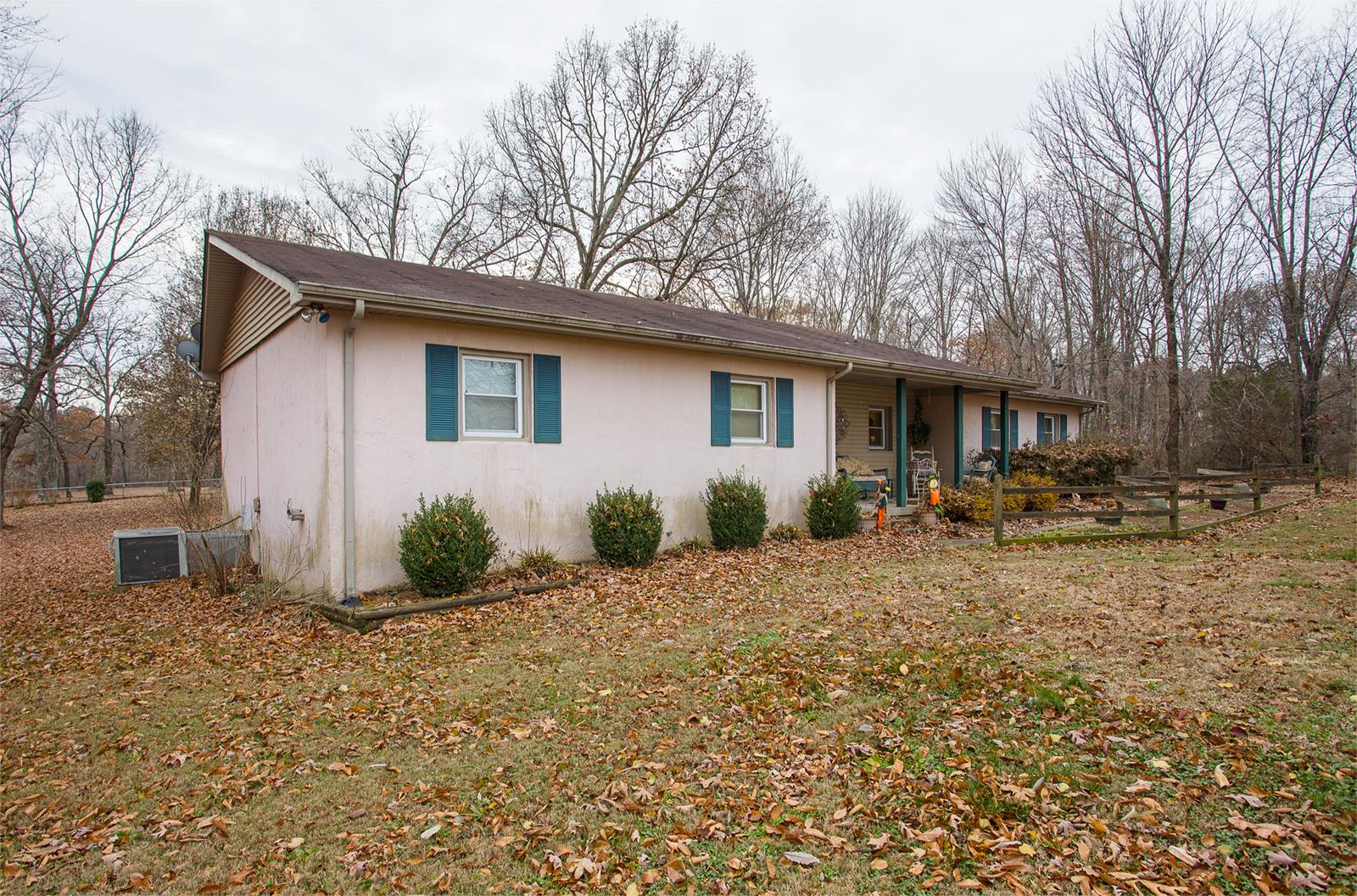 1803 Friendship Road Cross Plains, TN 37049 - Photo 3 of 20 a backyard of a house with table and chairs under an umbrella