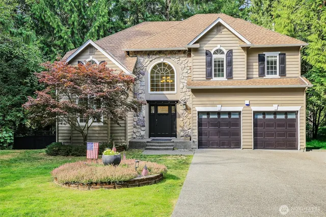 a front view of a house with a yard
