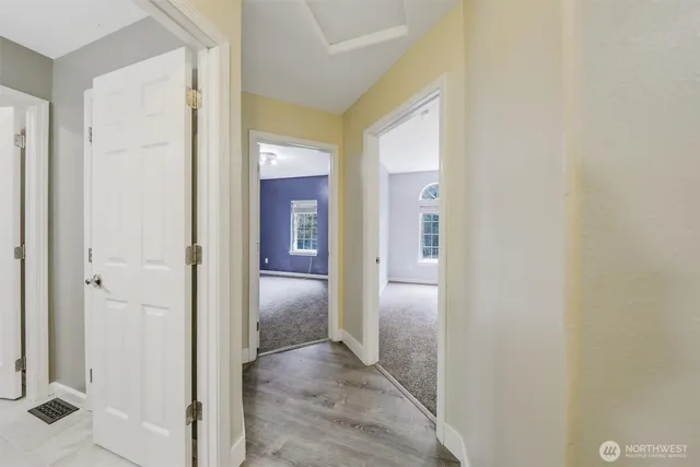 an entrance view of a bathroom from a hallway