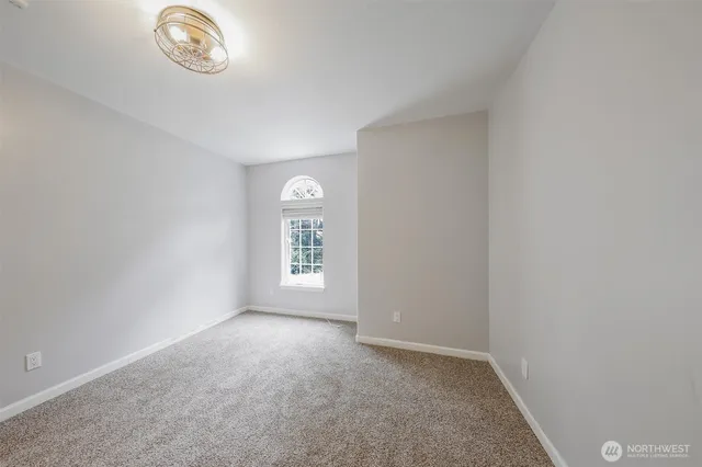 a view of room with window and stairs