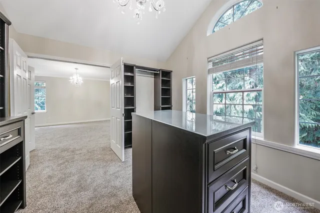 a kitchen with granite countertop a stove and a refrigerator