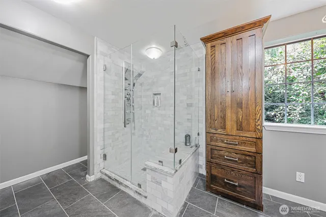 a bathroom with a shower and a tub