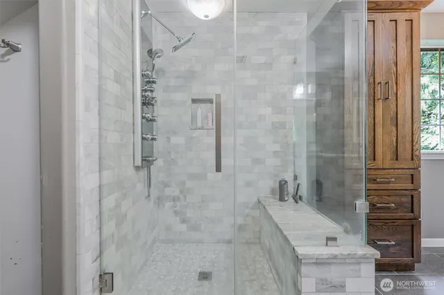 a bathroom with a shower and a sink