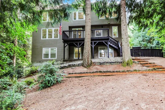 a front view of a house with a garden