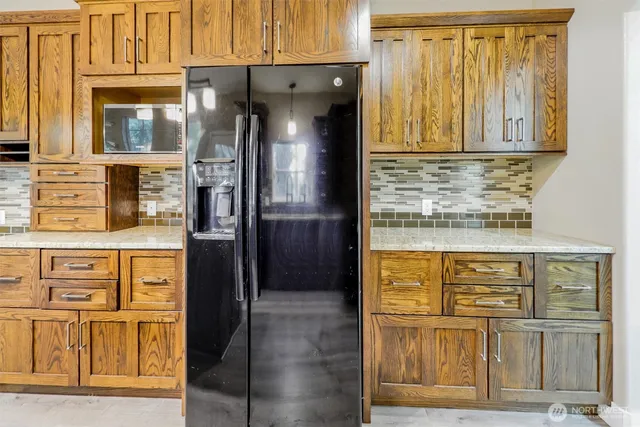 a view of a refrigerator in the kitchen