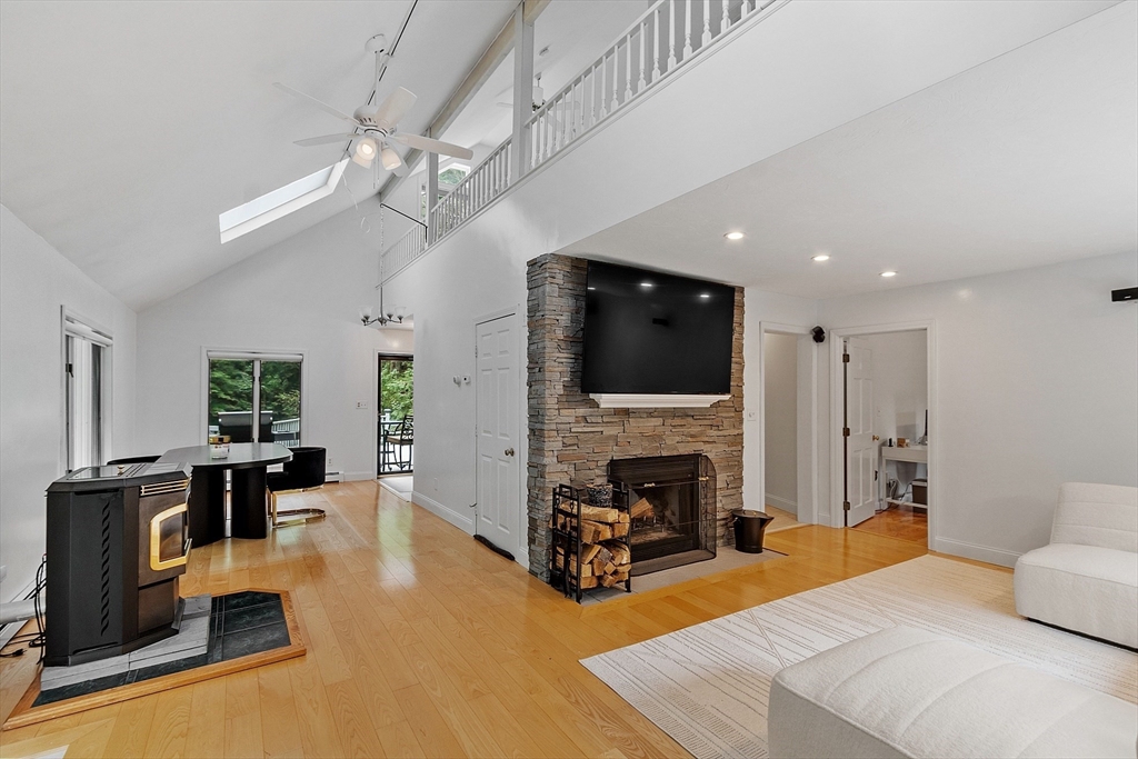 18 Crane Crossing Road Plaistow, NH 03865 - Photo 11 of 36 a living room with furniture fireplace and flat screen tv