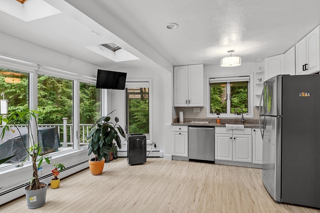 18 Crane Crossing Road Plaistow, NH 03865 - Photo 17 of 36 a kitchen with sink and refrigerator